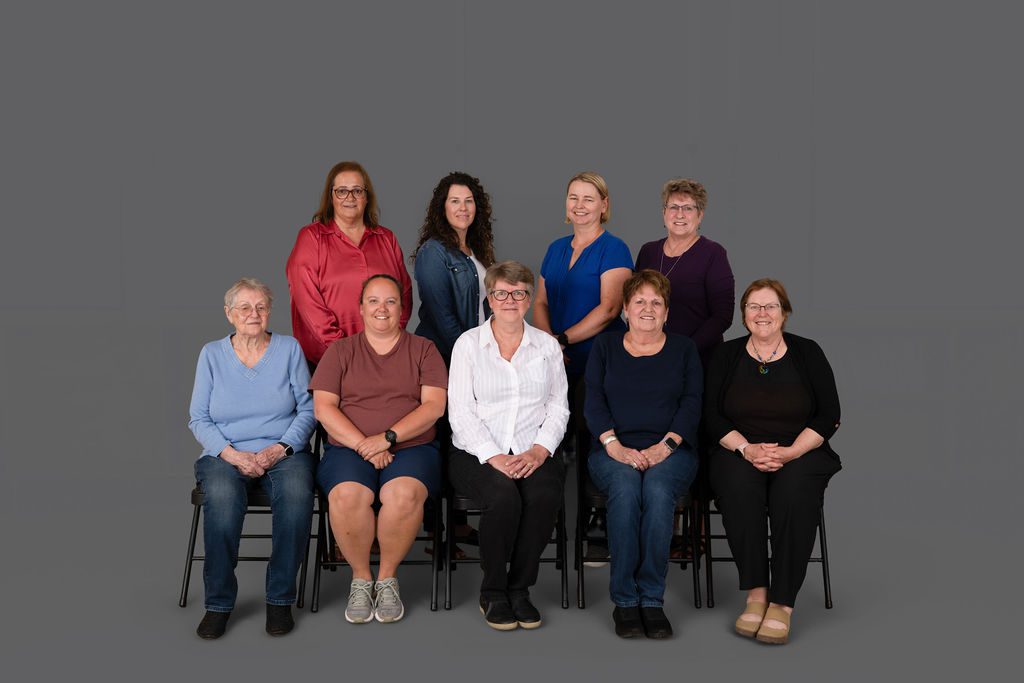 Group Staff Photo Christmas wreaths hanging on a wall